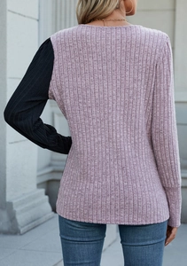 Detail of rib-knit long sleeve T-shirt featuring contrast stitching and soft purple texture