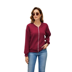 Detail of burgundy zip-up hoodie featuring unique textured diamond quilted fabric