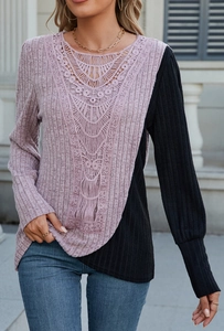 Detailed close-up of ribbed texture and elegant lace patchwork on long sleeve top