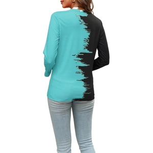 Detail showing the two-tone contrast stitching and paint brush texture on back of long sleeve top