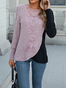 Detail view of purple and black ribbed knit top with delicate crochet lace neckline decoration