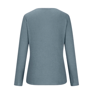 Detail view of the back of a waffle knit long sleeve top in a deep grey blue color