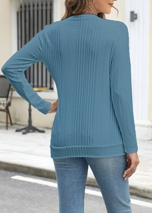 Detailed view of the ribbed knit texture and back design of this blue long sleeve shirt