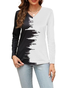 Women's V-neck long sleeve top featuring artistic black and white color block design