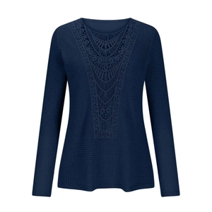 Detail of navy waffle knit top featuring V-shape crochet lace panel and textured fabric