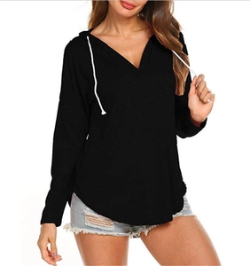 Detail of black V-neck hoodie with white drawstrings and curved hem in casual style