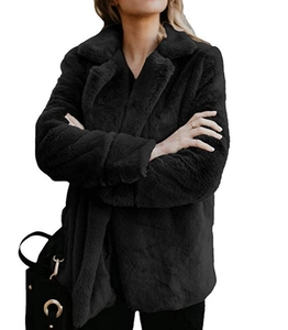 Detail view of plush black faux fur texture and lapel collar on the women's cropped jacket