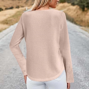Detail shot of pink waffle knit long sleeve top back view with ruffled trim and hemline