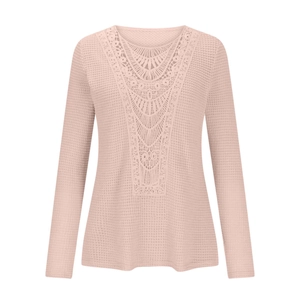 Close-up of pink waffle knit top with intricate crochet lace panel and crew neck detail