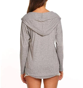 Rear view of grey V-neck hooded top featuring curved hem and soft knit texture