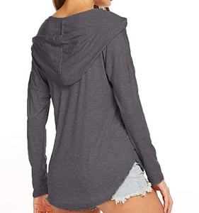 Back view of a long-sleeved gray hooded shirt with curved hem and side slits for women