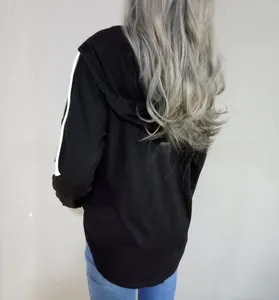 Rear view of black hooded sweatshirt with white side stripes on sleeves in casual cotton knit