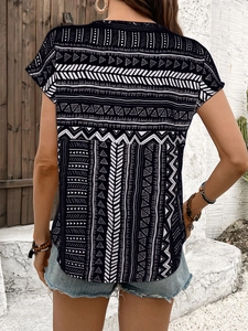 Back view of a summer short sleeve top with ethnic geometric pattern and round neck