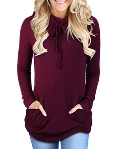 Detail view of the drawstring hood and crossover neckline on this wine red hoodie