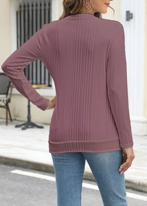 Detail of slim fit ribbed long sleeve top in deep purple, back view on outdoor street