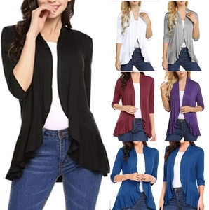 Detail view of women's open-front cardigans with ruffle hem in six assorted colors