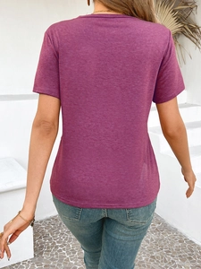 Back view of a slim fit magenta short sleeve t-shirt with knit texture and garden backdrop