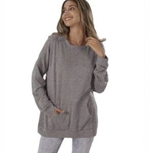 Detail view of grey oversized sweatshirt fabric with front kangaroo pocket and round neck