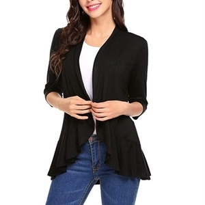 Detail view of the black open-front cardigan with elegant draped ruffle hem design