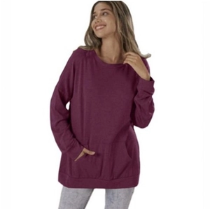 Detail of deep purple loose fit sweatshirt showing crewneck and front pocket design