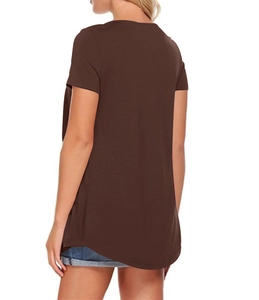 Detail of loose dark brown short sleeve T-shirt with curved hem and round neck design