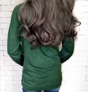 Rear view of a casual dark green long sleeve crewneck top paired with classic blue jeans