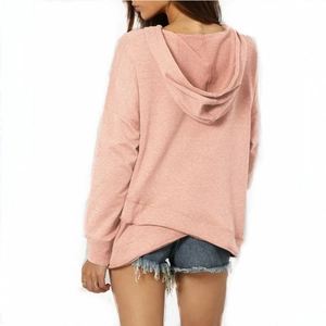Rear view of peach pink hoodie featuring unique asymmetric criss-cross hem detail