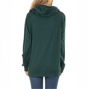 Detail of the hooded drawstring structure on a dark green oversized cotton hoodie