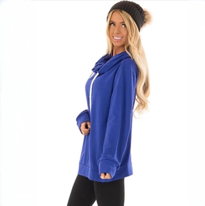 Detailed close-up of bright blue drawstring hoodie featuring a cozy high cowl neck design