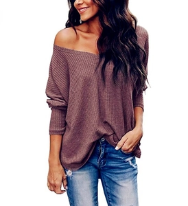 Detail of loose V-neck waffle knit long sleeve top in deep dusty rose with ribbed texture
