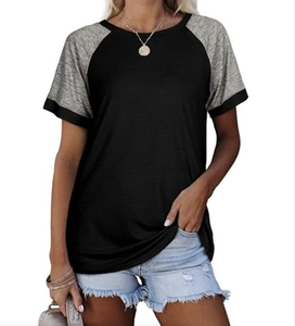 Close-up of raglan sleeve detail and crew neck stitching on women's contrast t-shirt