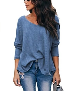 Detail of blue long-sleeve V-neck waffle knit top showing texture and relaxed fit