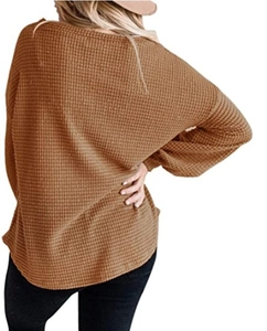 Back view of caramel waffle knit long sleeve top featuring a loose fit and round neck