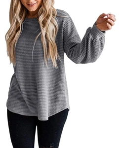Detail of grey waffle knit texture and puff lantern sleeves on a loose casual top