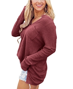 Detail of waffle knit fabric on V-neck loose fit top with chest pocket in burgundy