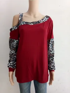 Detail of burgundy long sleeve top with leopard print patchwork on cuffs and neckline