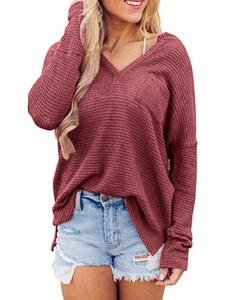 Detail of mauve waffle knit texture with V-neckline and chest pocket on loose top