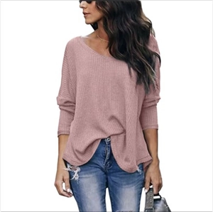 Detail view of dusty rose waffle knit V-neck long sleeve top with drop shoulders