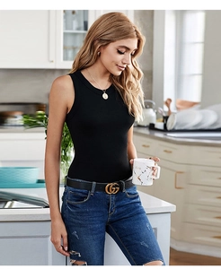 Detail of a slim-fit black ribbed knit tank top showing high-quality fabric texture