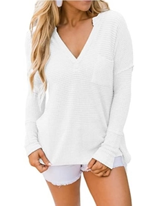 Detail of white V-neck waffle knit top featuring a chest pocket and textured fabric