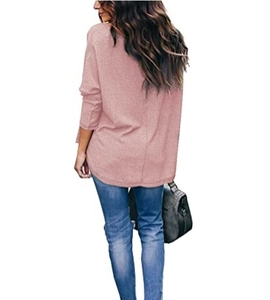 Detail of pink waffle knit long sleeve top with curved hem and dropped shoulders