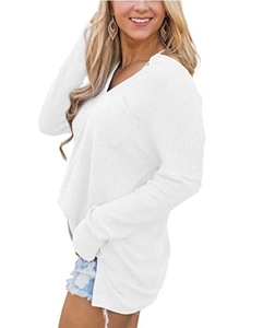 Close-up of white waffle knit texture and V-neckline detail on a long-sleeve casual top