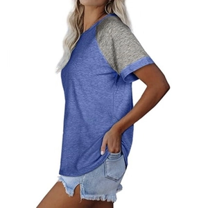Side view detail of a round neck color-block t-shirt with raglan sleeves and marl texture