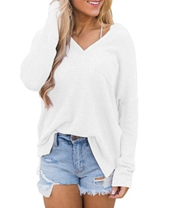 Close-up of white V-neck long sleeve top with waffle knit texture and ribbed cuffs