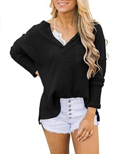 Detail of black waffle knit V-neck top with side slits and soft textured fabric finish