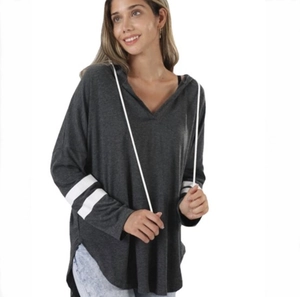 Detail of grey V-neck hoodie featuring white sleeve stripes and contrast drawstrings