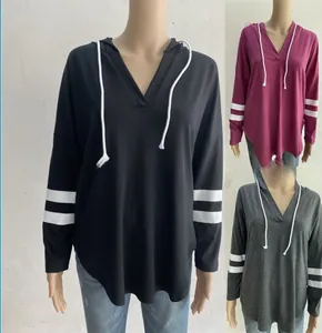 Detail of V-neck hoodie with white drawstrings and sleeve stripes in three colors