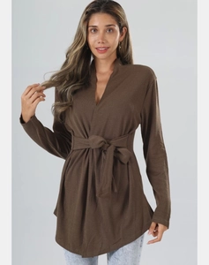 Detail of coffee brown long sleeve tie-front top with V-neck wrap design and waist drawstring