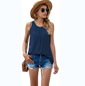 Close-up of a sleeveless dark blue tank top with pleated crew neck detail for women
