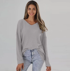Close-up of grey waffle knit texture and V-neckline on this casual loose women's top